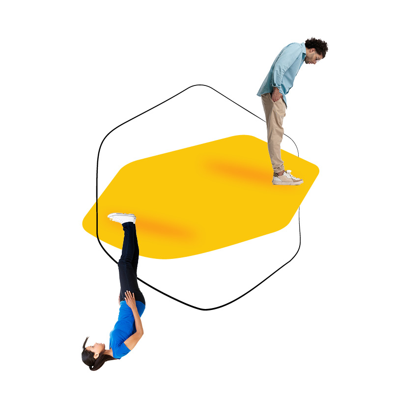 Two people interacting with a yellow geometric shape.