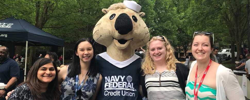 Anna Jumamil with her colleagues at Navy Federal Credit Union in America