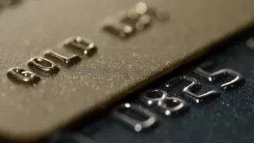  Multiple credit cards arranged side by side, highlighting their unique patterns and branding.