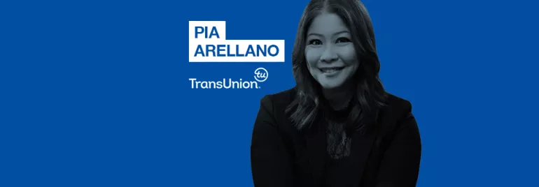Professional woman smiling, wearing business attire on a blue background with TransUnion logo and name.