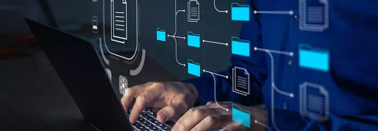 Person typing on laptop with digital file and folder icons overlayed.