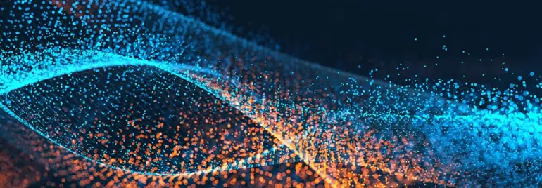 Abstract digital wave of glowing blue and orange particles.