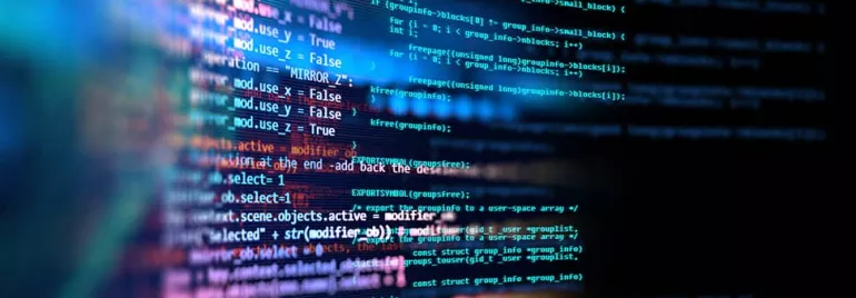 Close-up of colorful computer code displayed on a screen.
