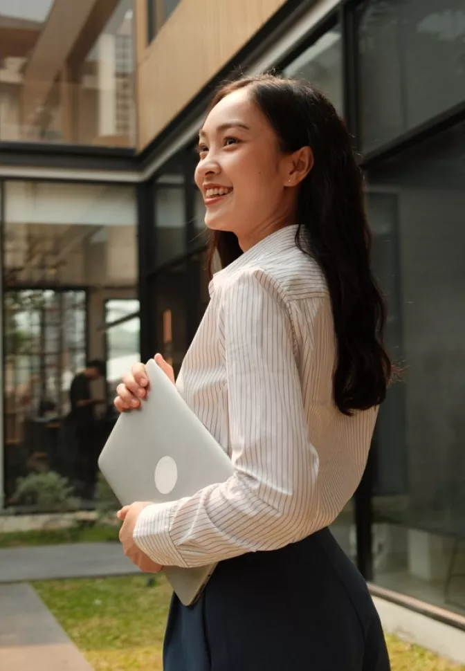Woman holding a laptop