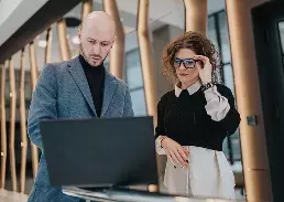 2 people working together