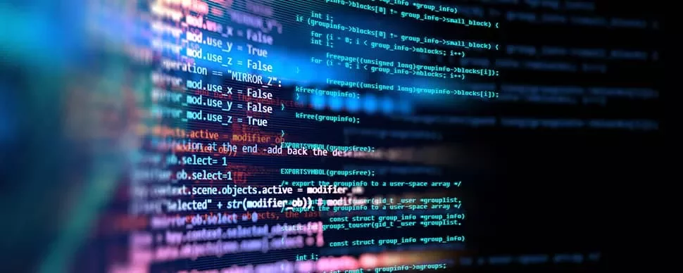 Close-up of colorful computer code displayed on a screen.