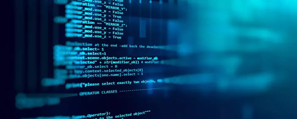 Close-up of computer code on a screen, showing various programming commands and functions.